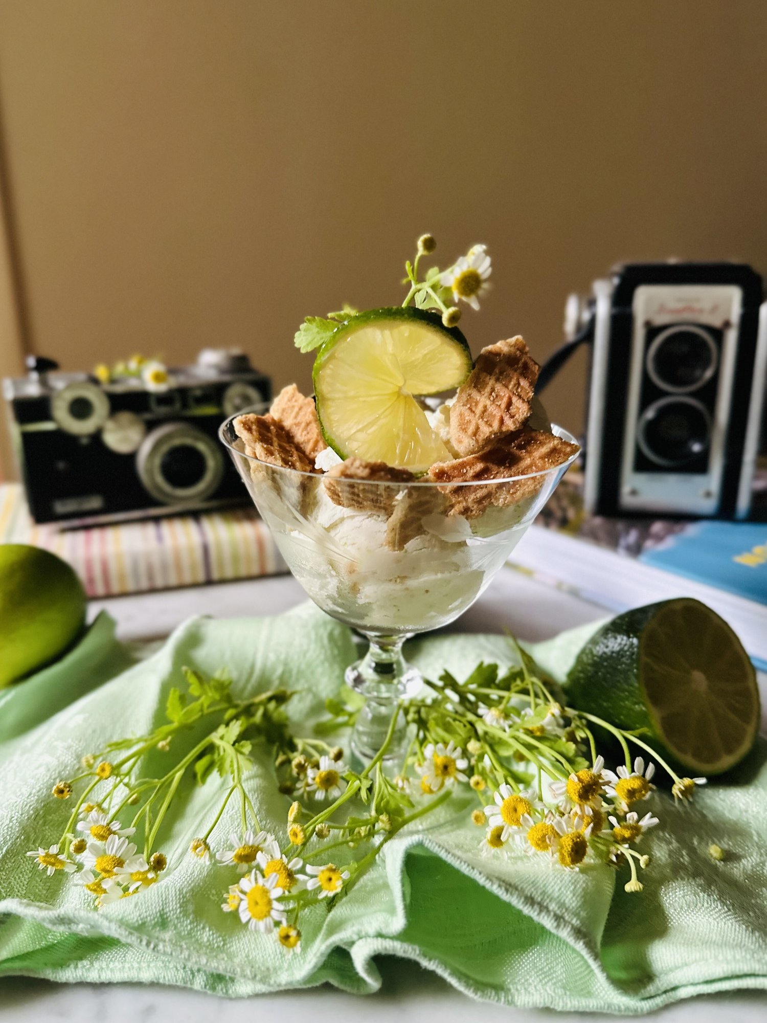 Bowl of key lime pie ice cream topped with graham crackers
